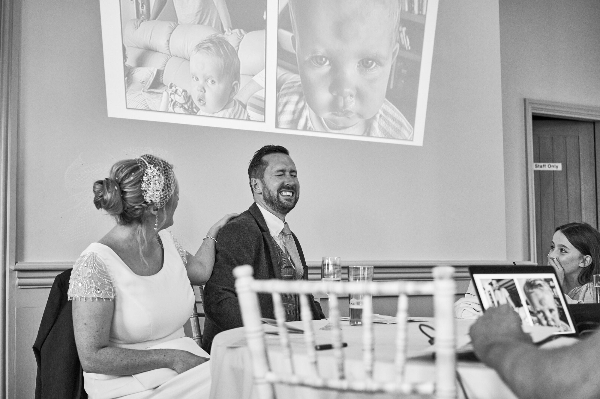 the groom looks embarrassed during the speeches