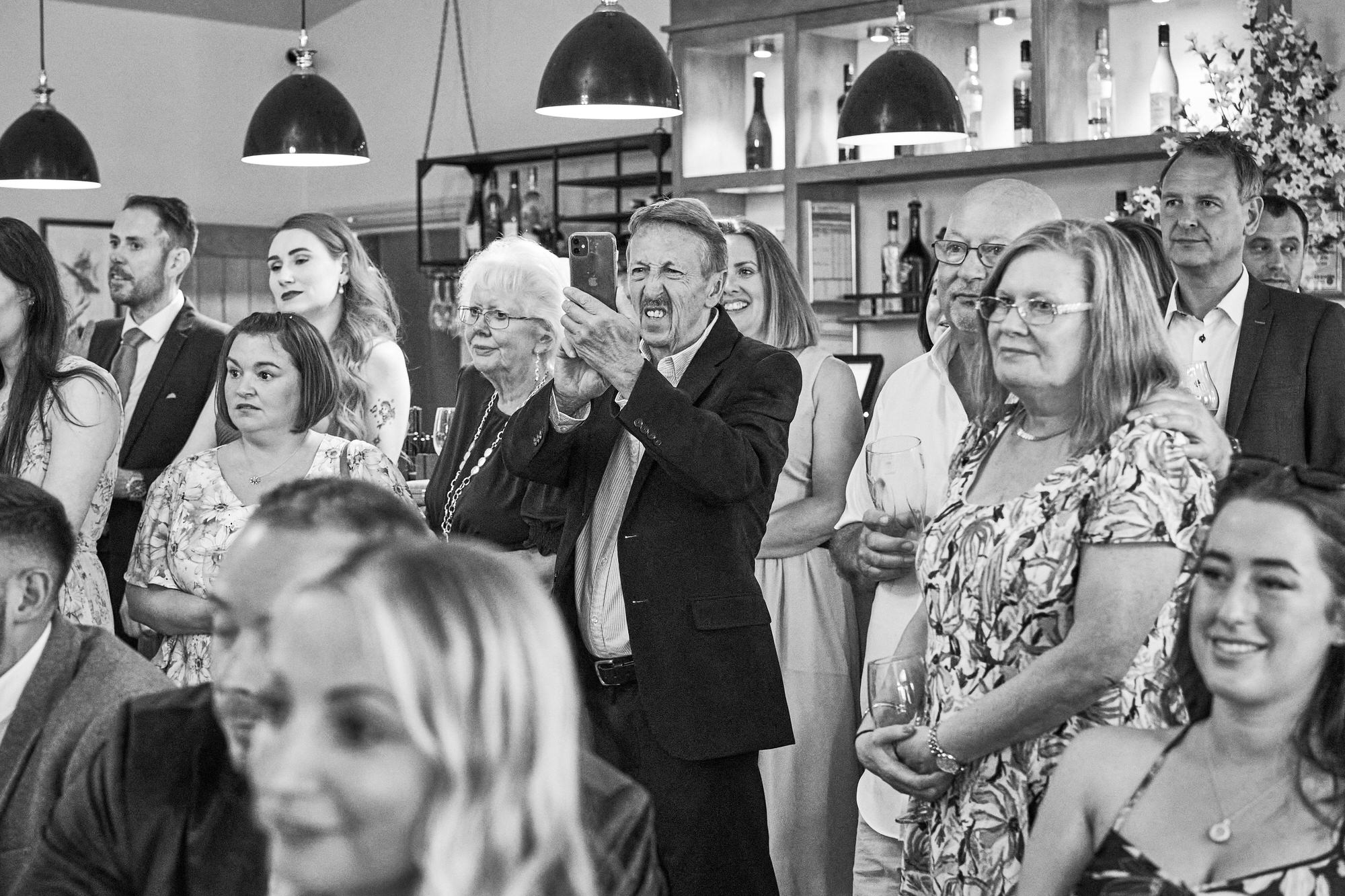 a fun photo of a guest struggling to take a photo with their phone