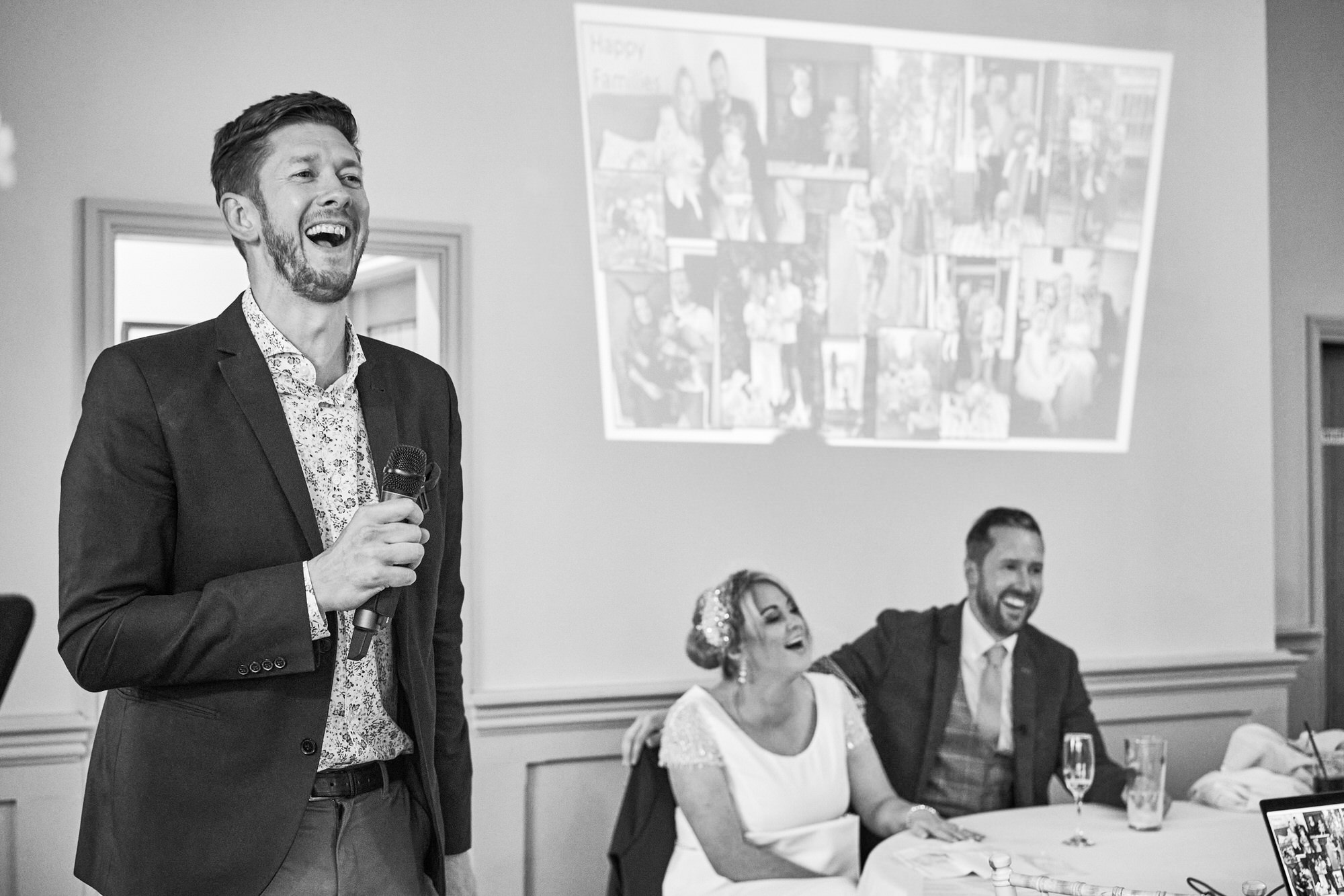 the best man makes the couple laugh during his wedding speech