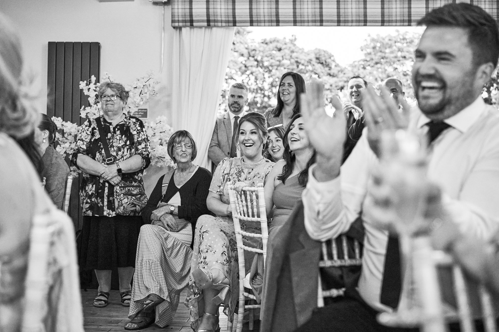 a natural photo of guests enjoying wedding speeches at The Aviary Ormskirk
