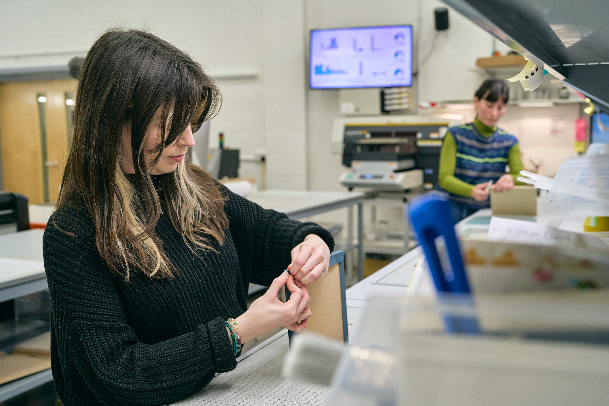a behind the scenes photo of staff working on products
