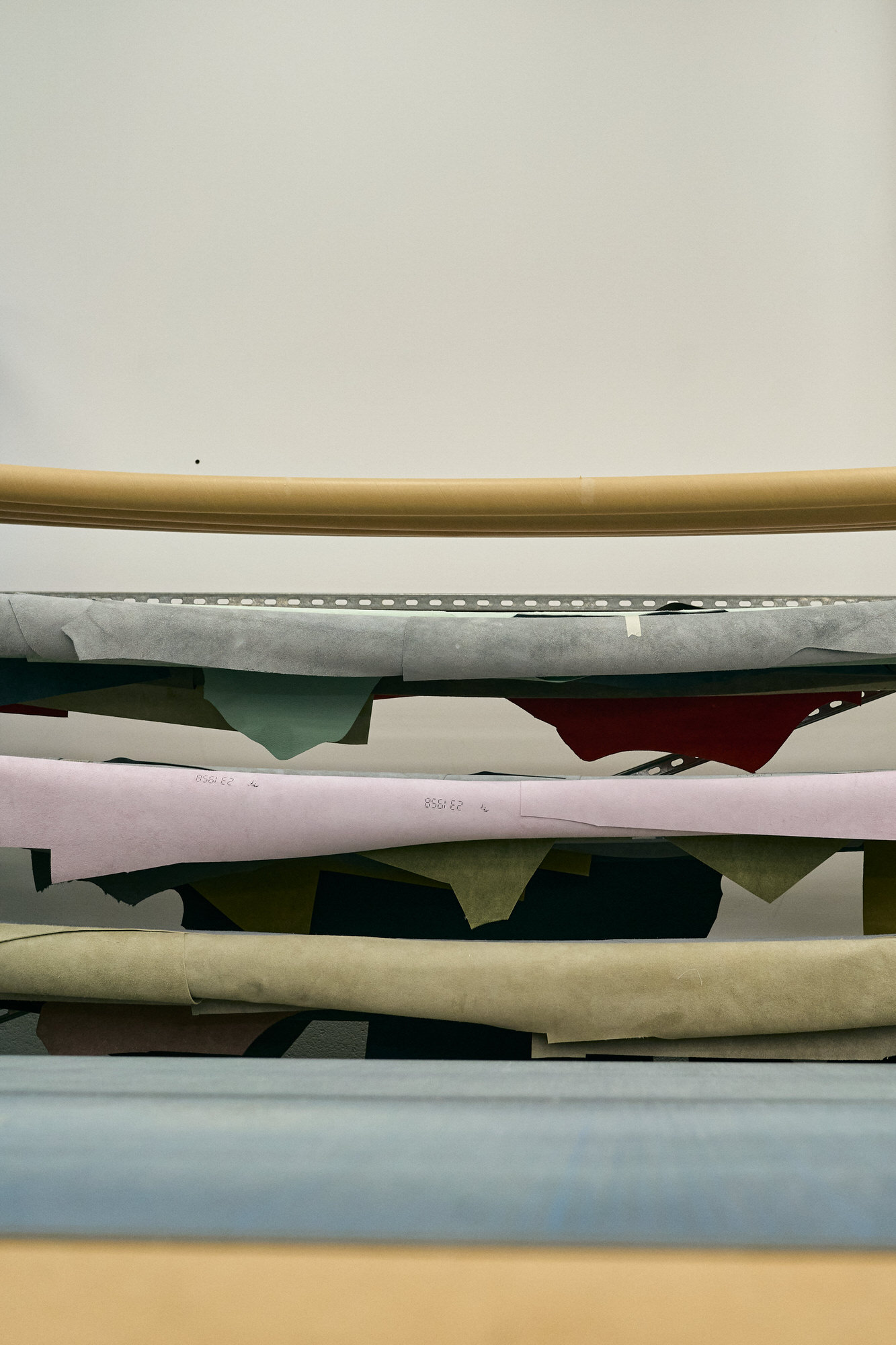 a photo of rolls of luxury fabrics used for photo albums and products