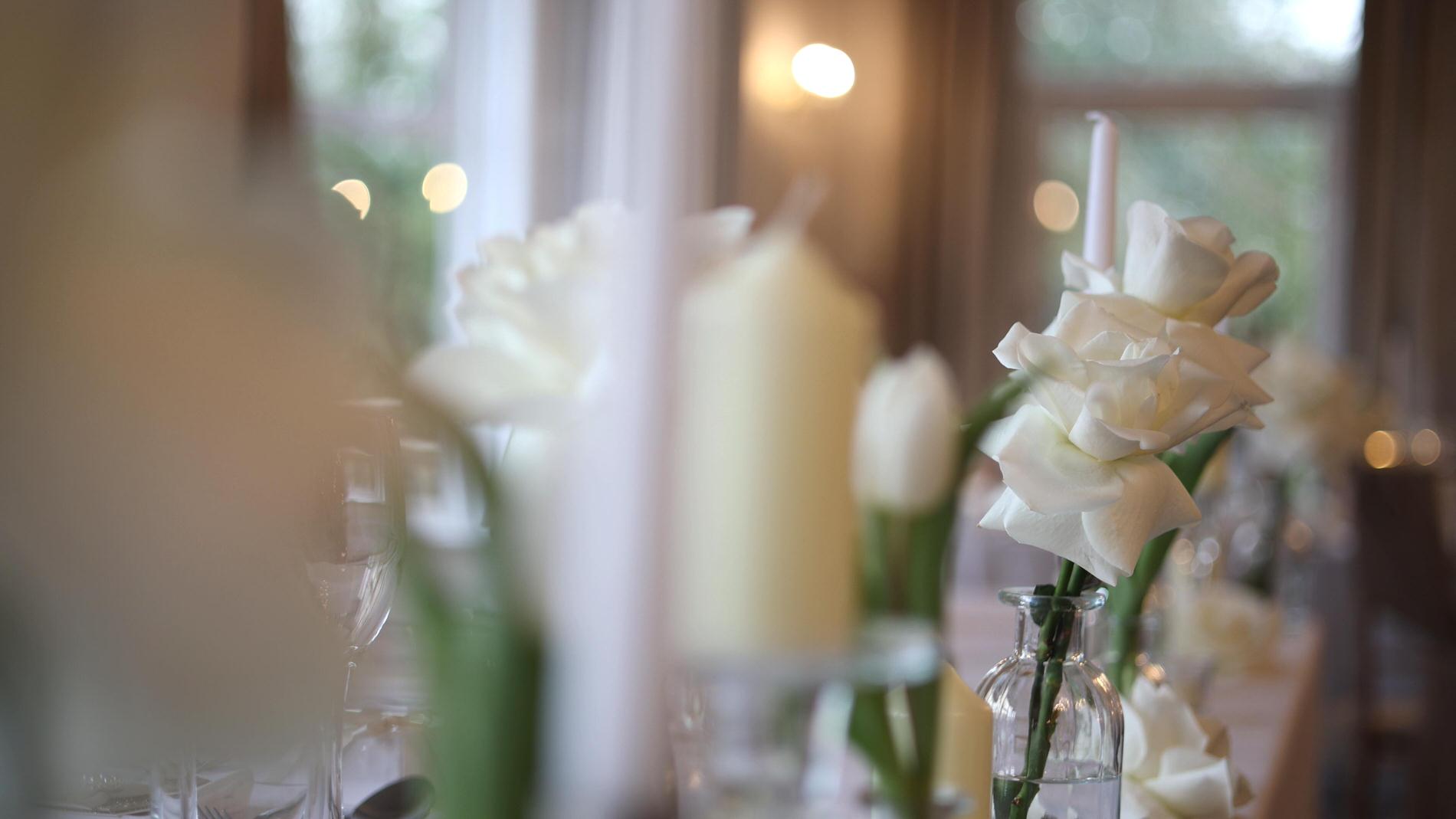 a close up video still of a top table dressed in white at Ashfield House Standish
