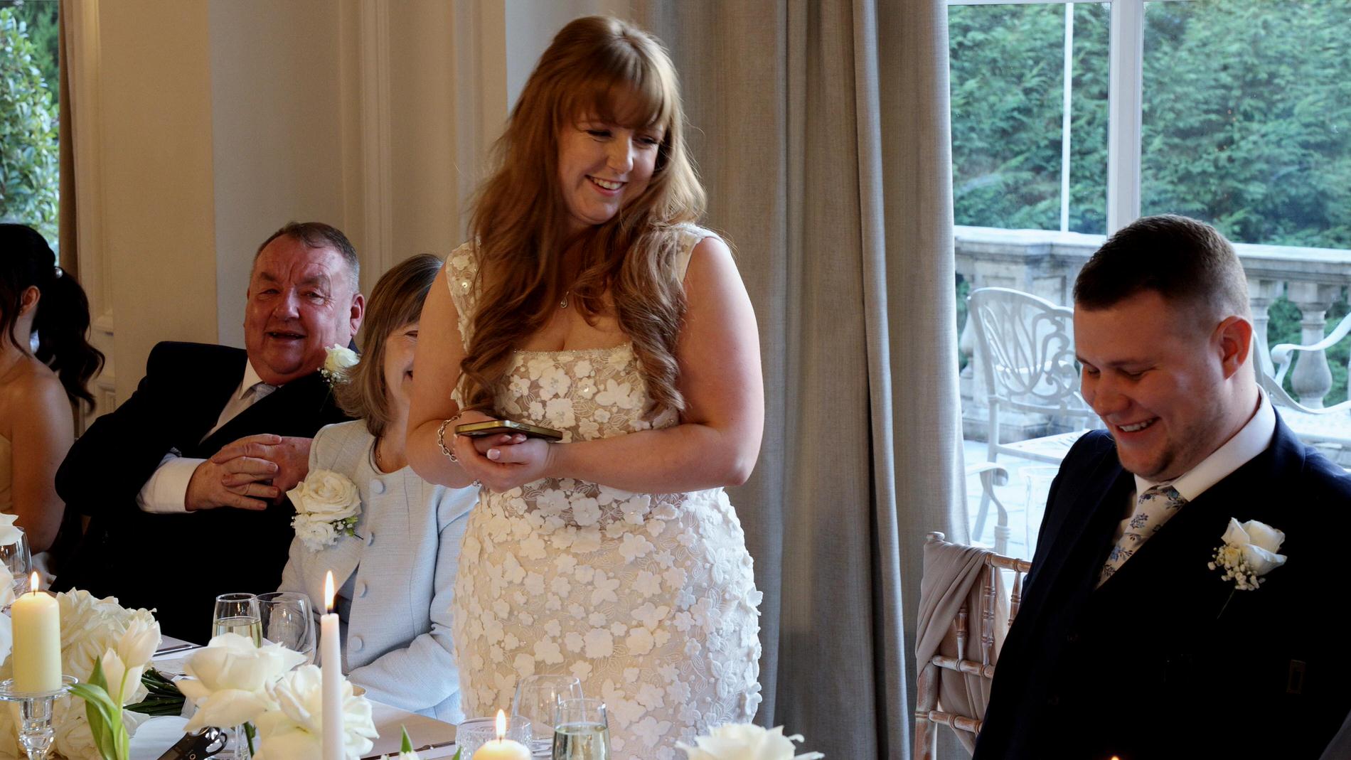 the bride stands to give a speech at Ashfield House Standish