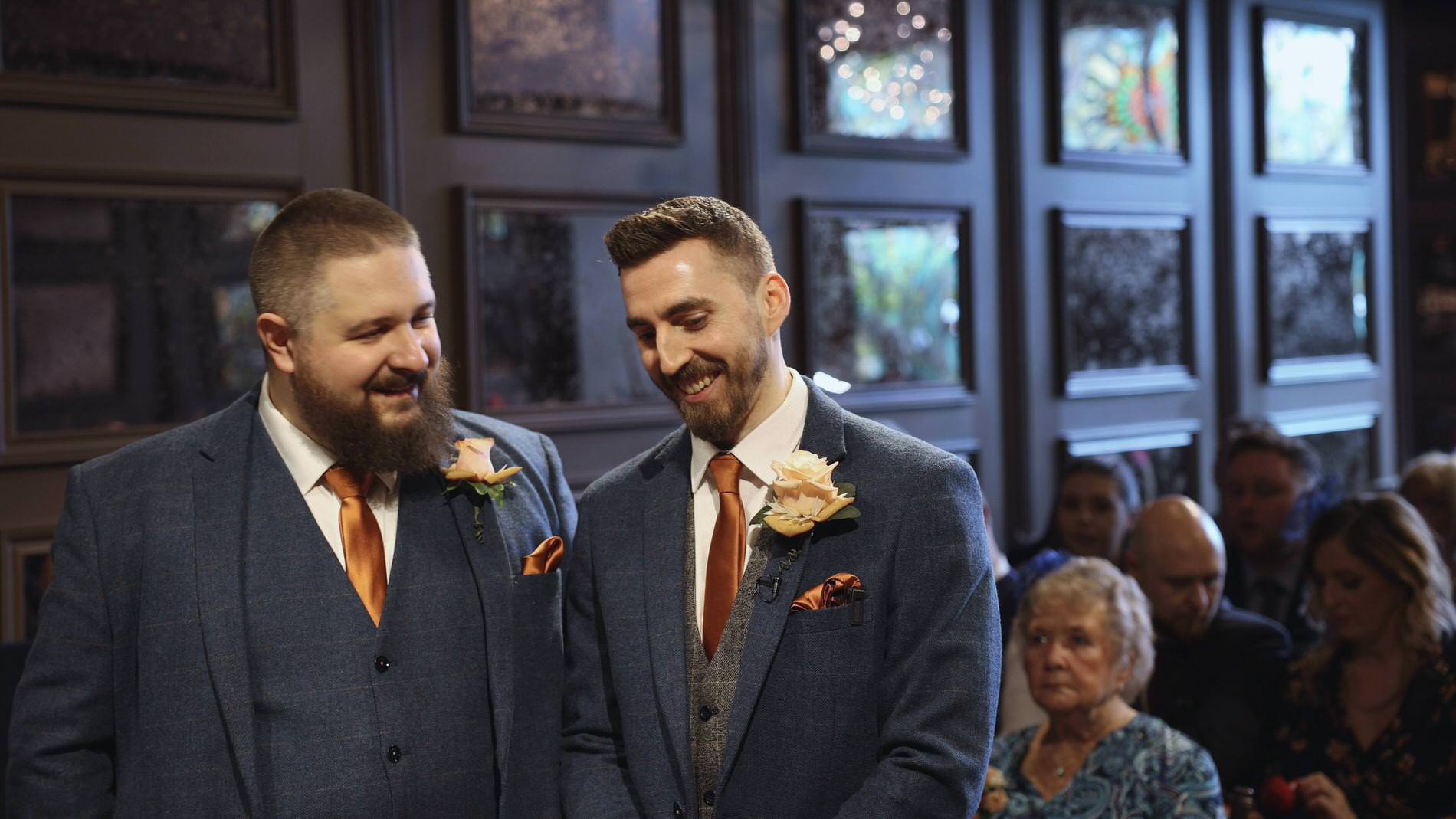 the groom and best man laugh before the wedding ceremony at Manor House Lindley
