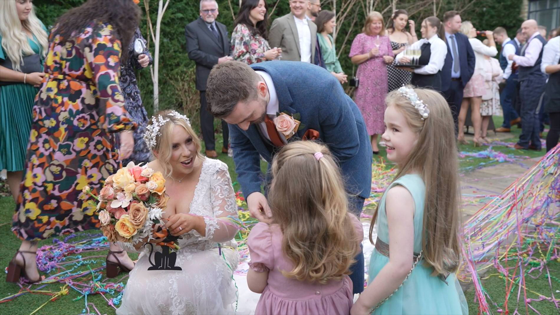 video still of the couple with small children guests at a wedding at Manor House Lindley