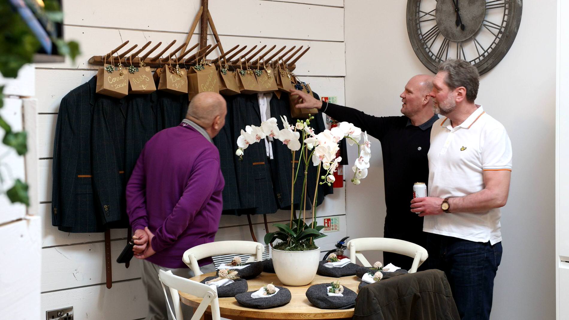 the older groomsmen check out the peaky blinder style suits