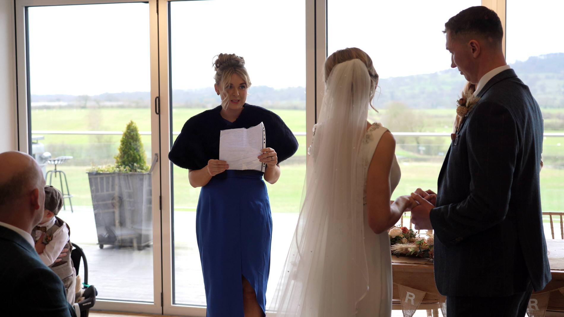 a wedding guest gives a reading at the wedding ceremony