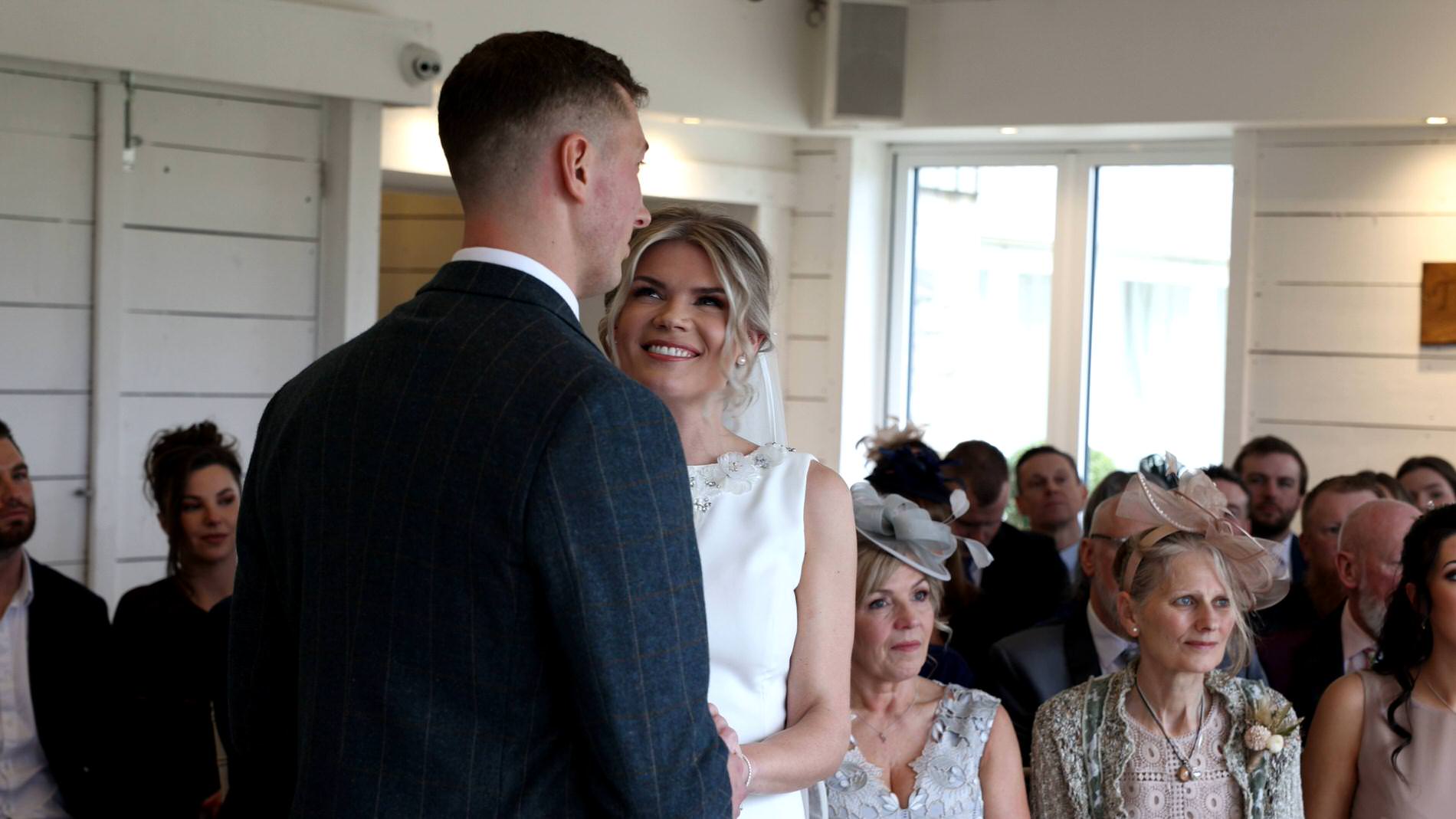 the bride laughs during the wedding vows