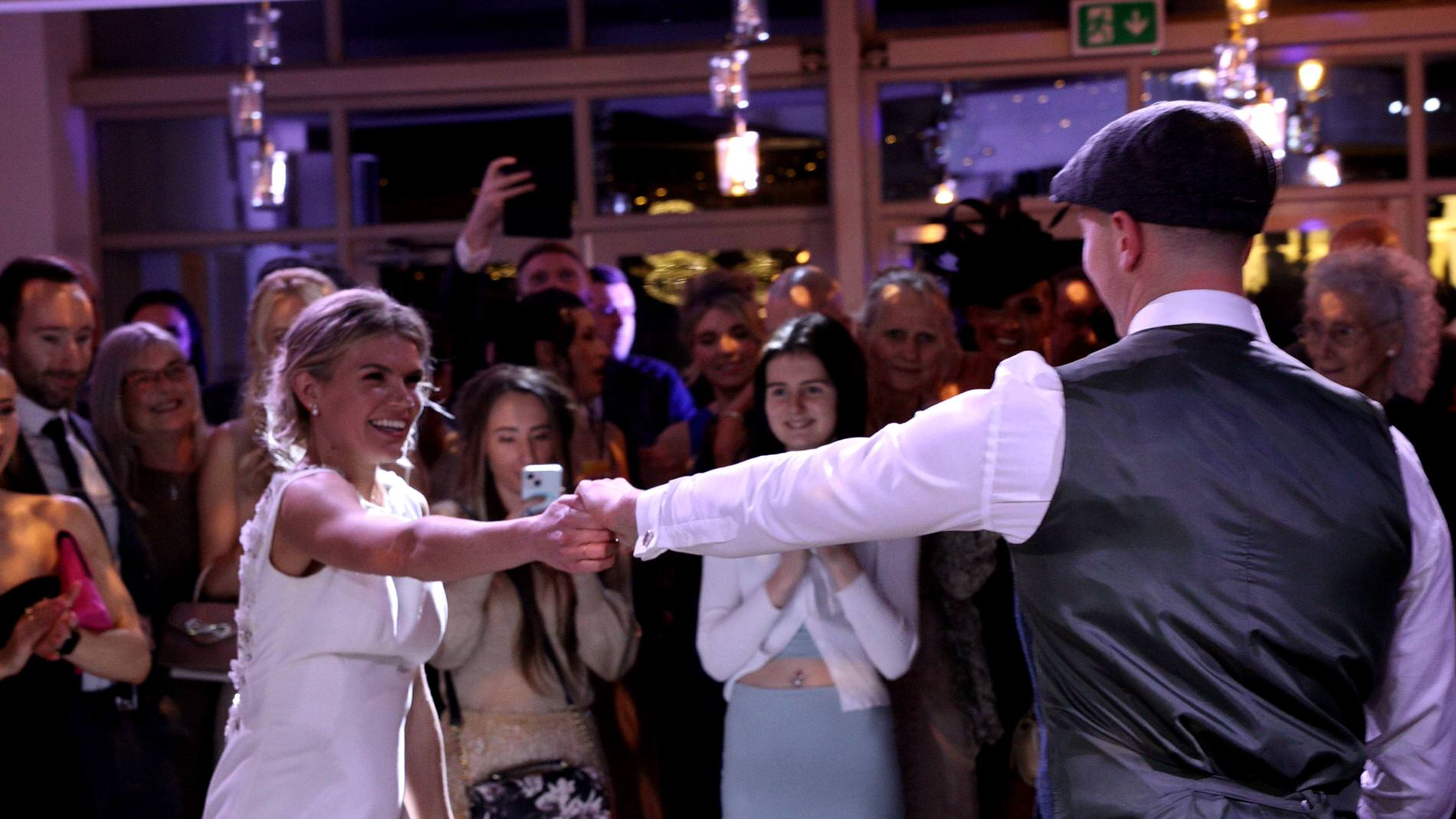 a bride and groom enjoy a first dance at Bashall Barn