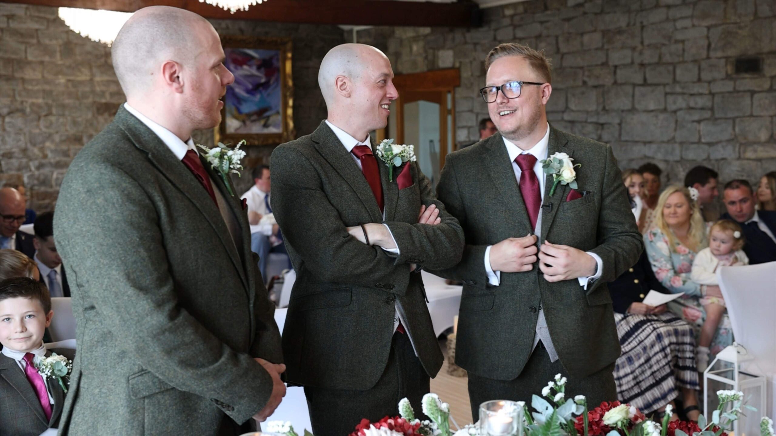 a groom jokes with his best man and groomsman before the ceremony at The Saddleworth Hotel