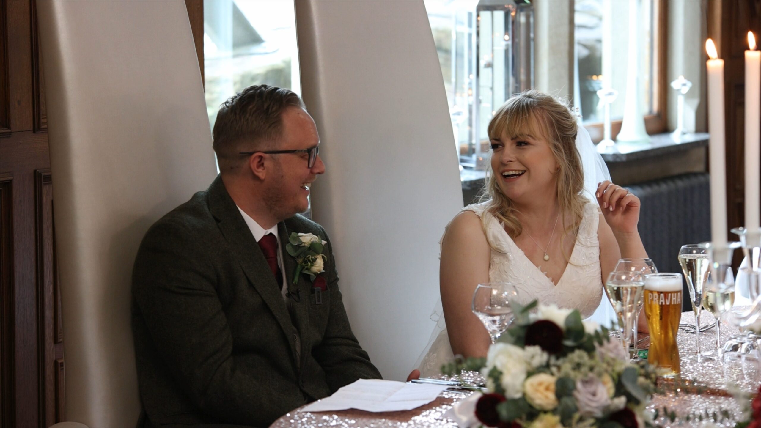 a couple laugh together during the wedding speeches at The Saddleworth Hotel