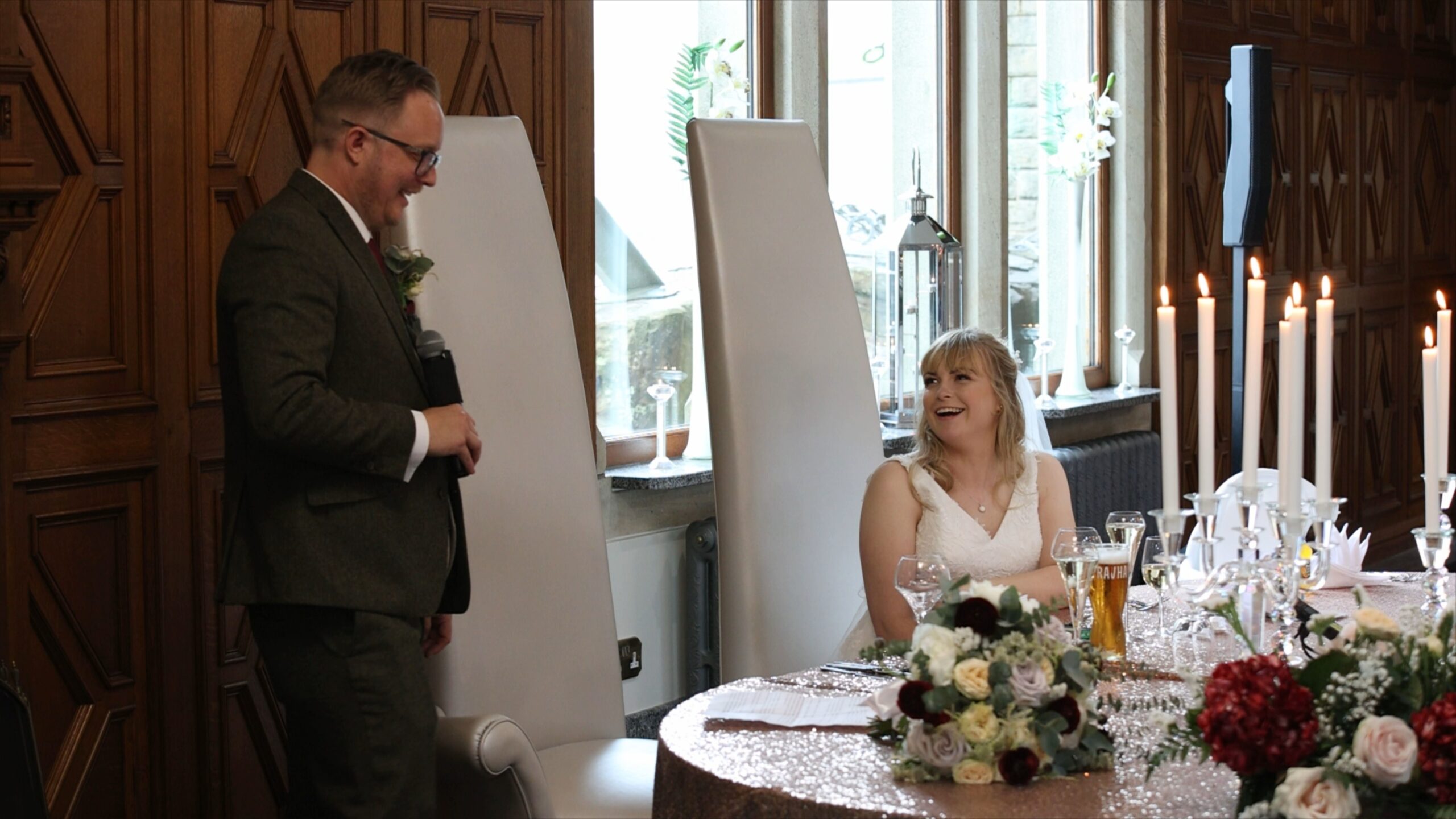 the groom standing to deliver his wedding speech