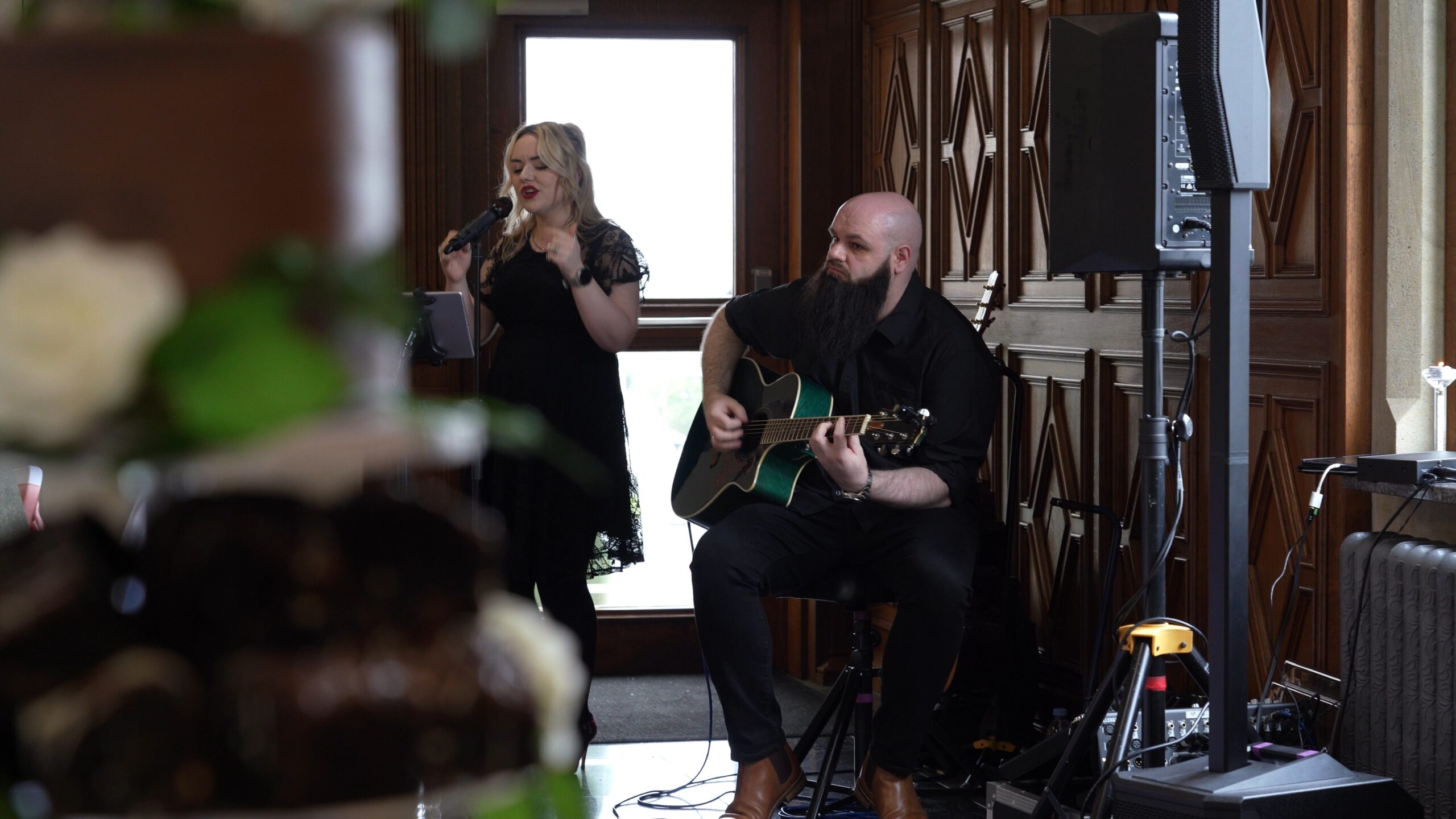 an acoustic duo perform during the wedding breakfast