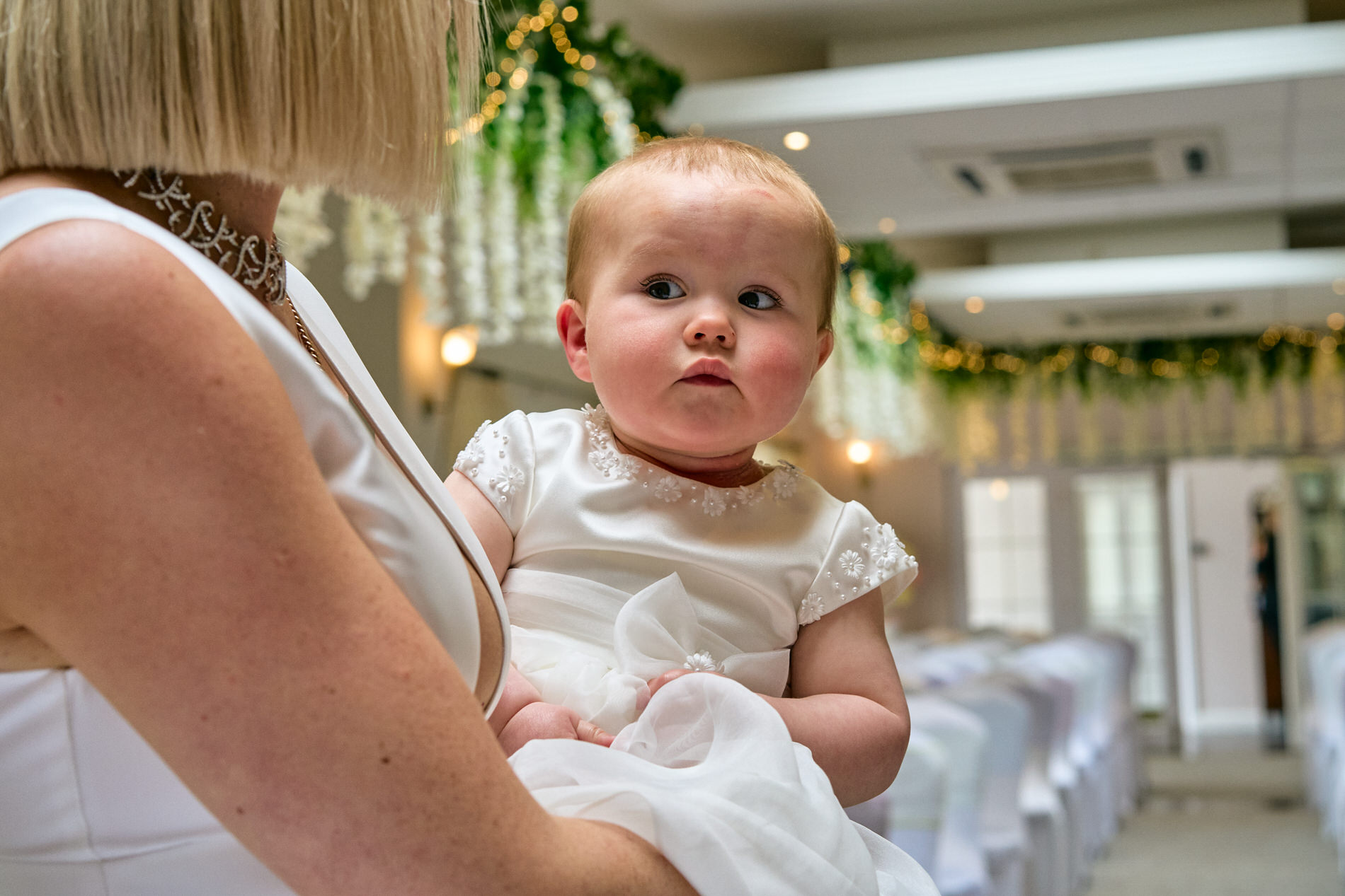 little girl in her christening gown at holland hall