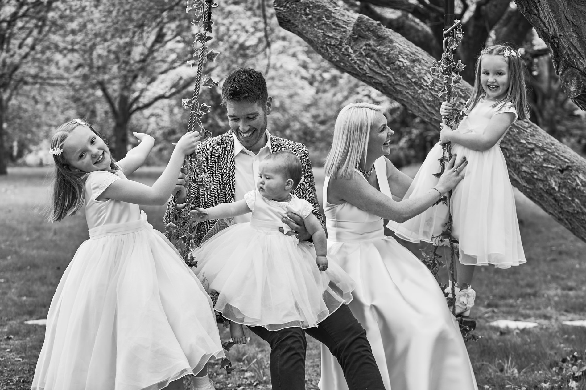 a fun and natural family photo outdoors at Holland Hall