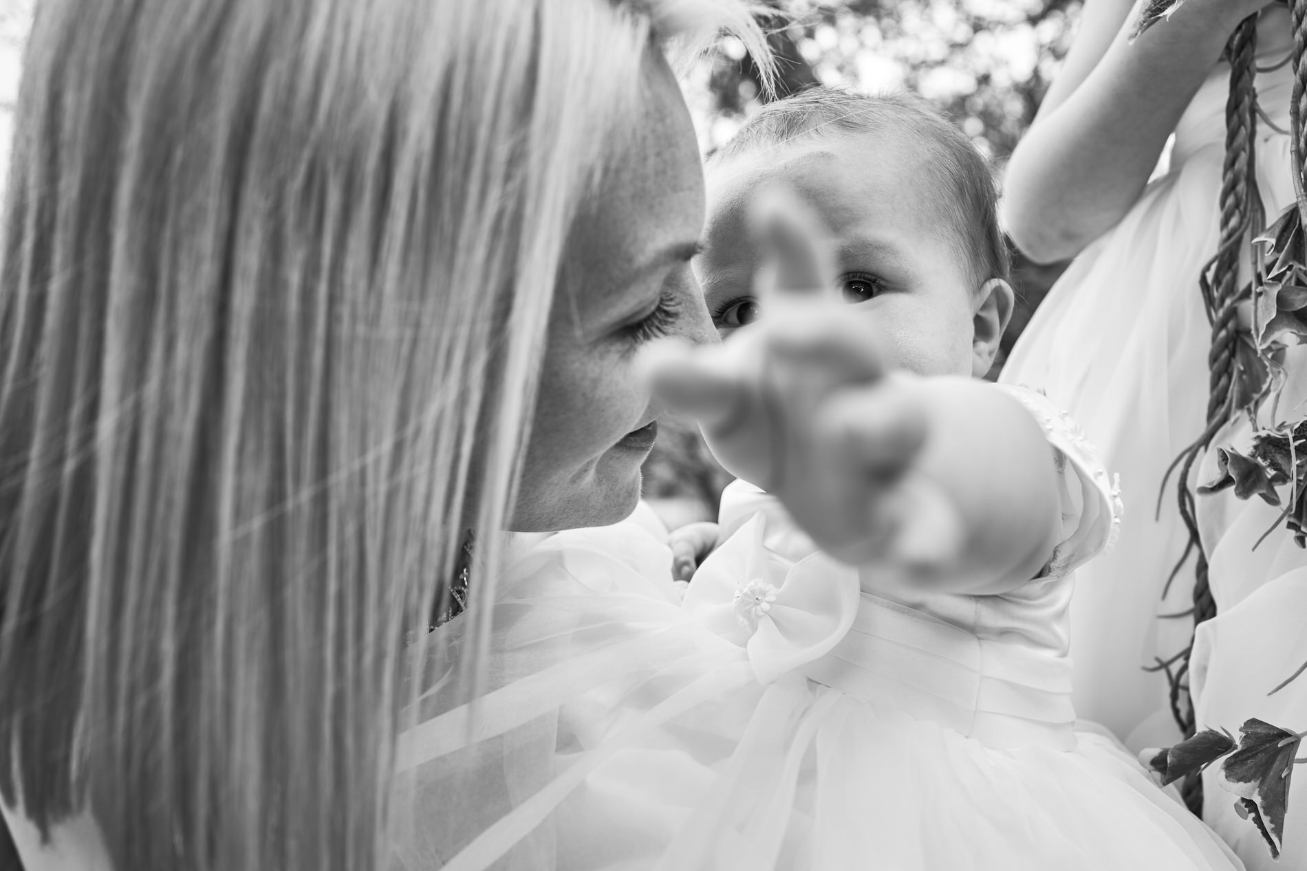 a cute close up photo of a baby leaning towards the photographer