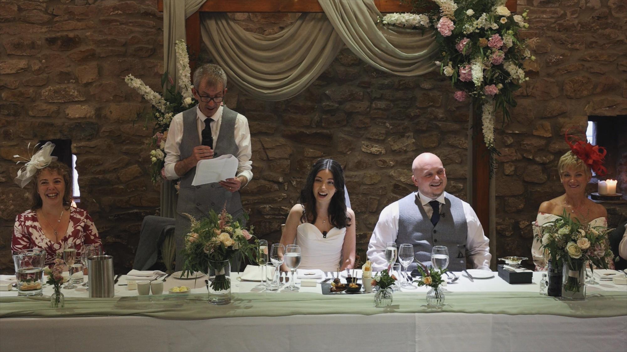 a father of the bride stands for his speech at Browsholme Hall wedding