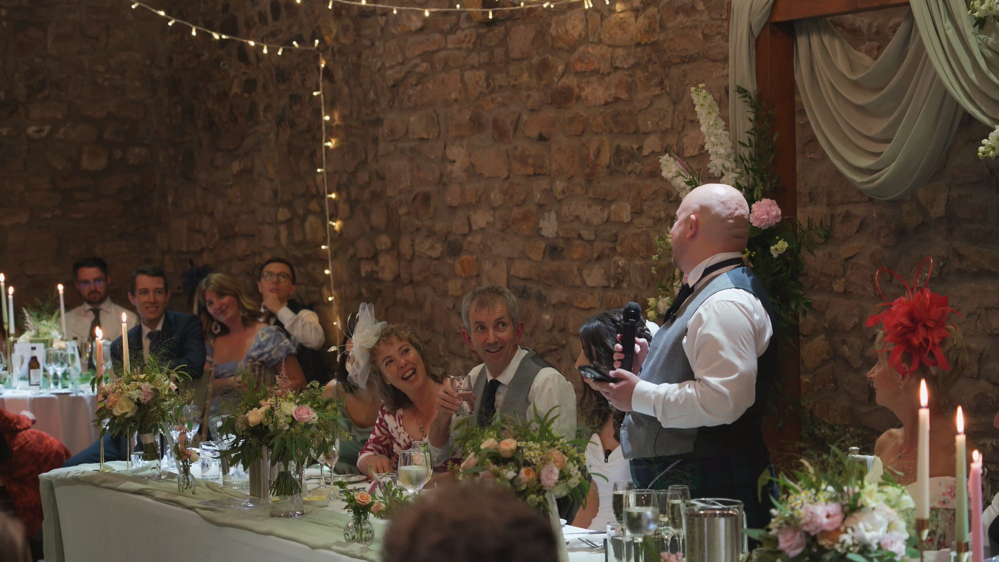 a groom has the top table laughing during his speech