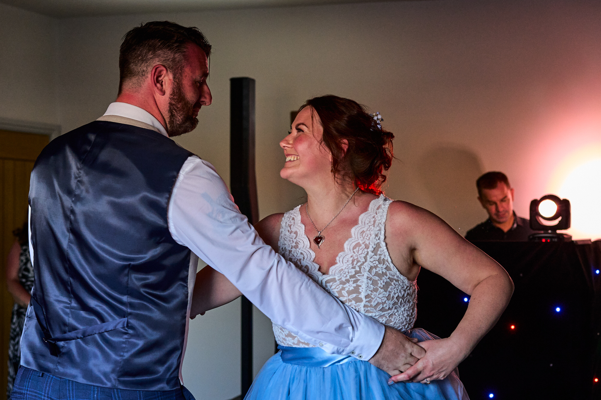 a couple smile during their wedding first dance at The Aviary Ormskirk