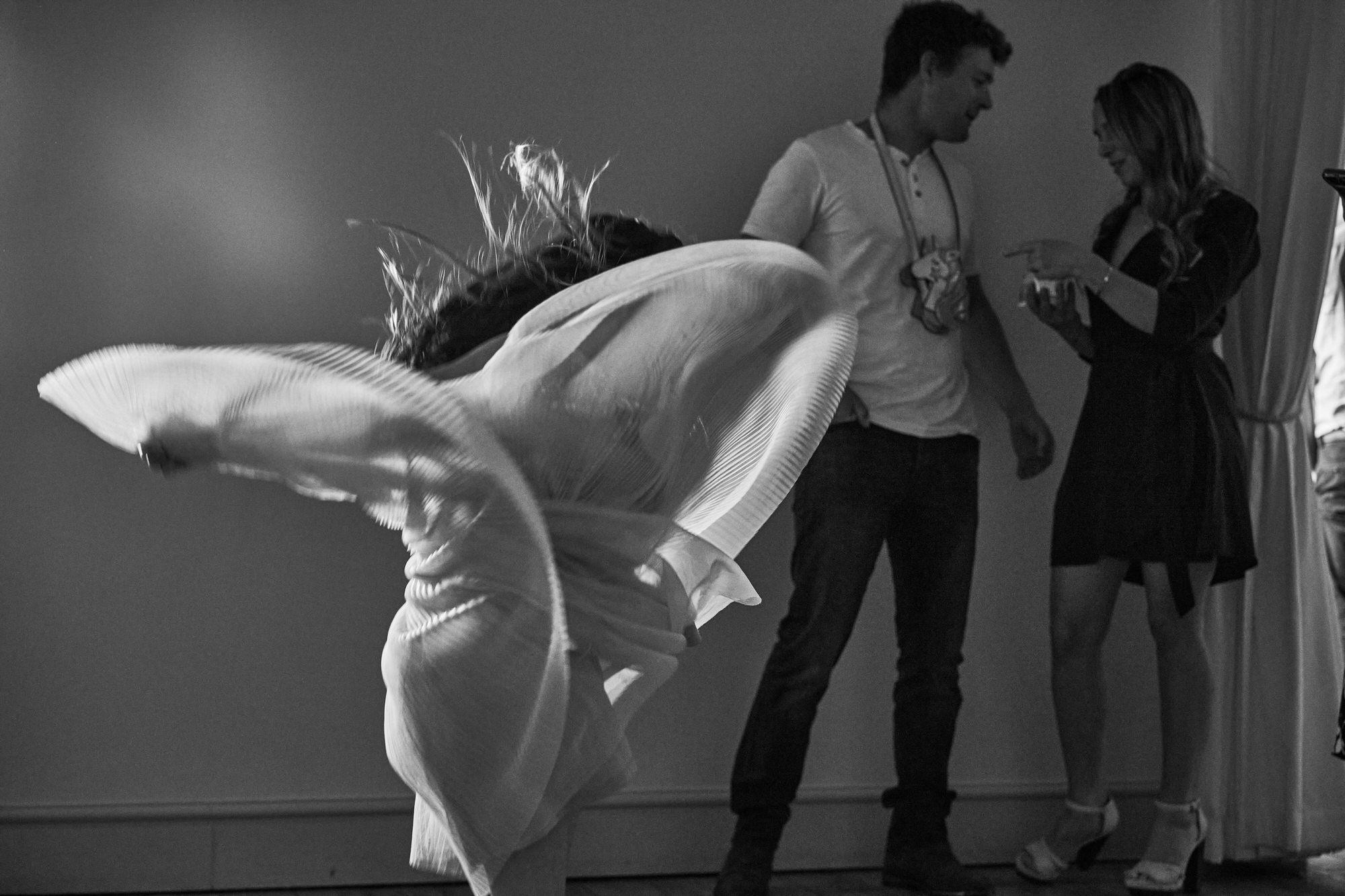 a fun and artistic shot of a young girl swinging her dress around dancing