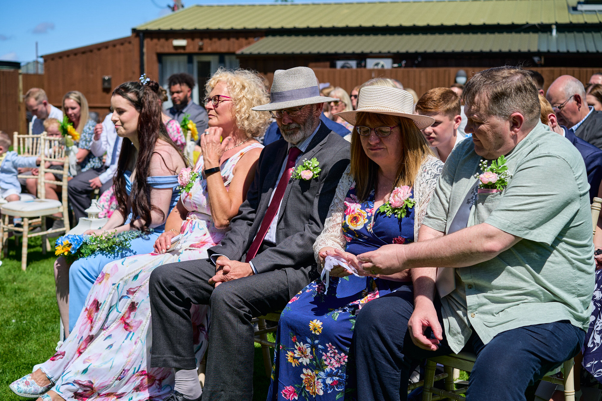 guests pass the rings round to warm during celebrant led wedding
