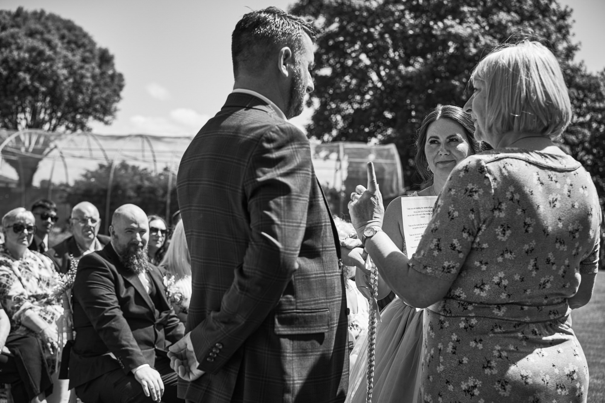 a couple say their promises during a hand fasting