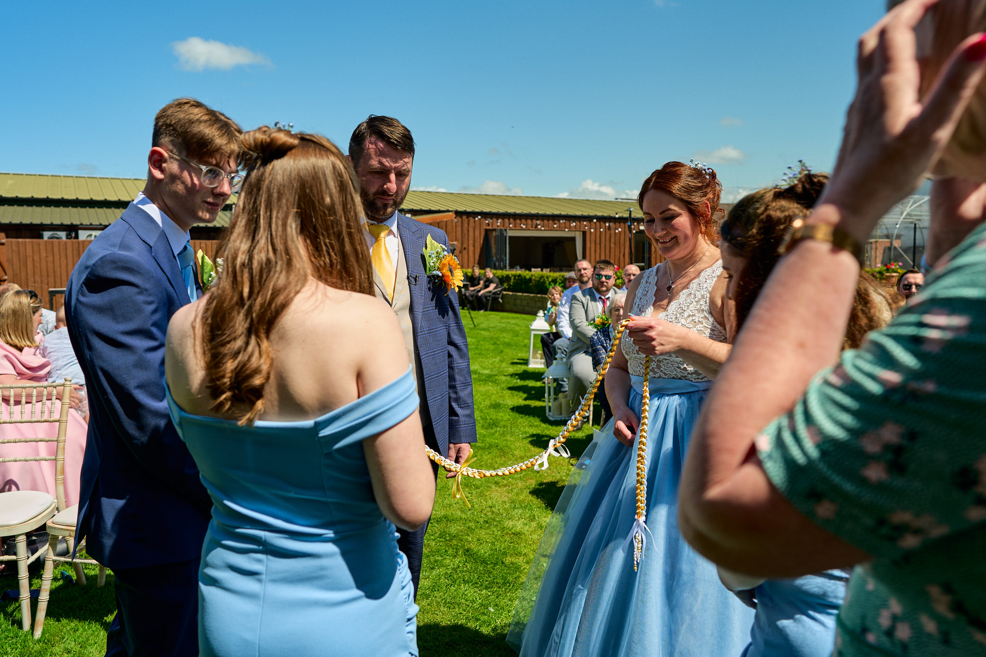 the family include their children in the hand fasting ceremony at The Aviary Ormskirk