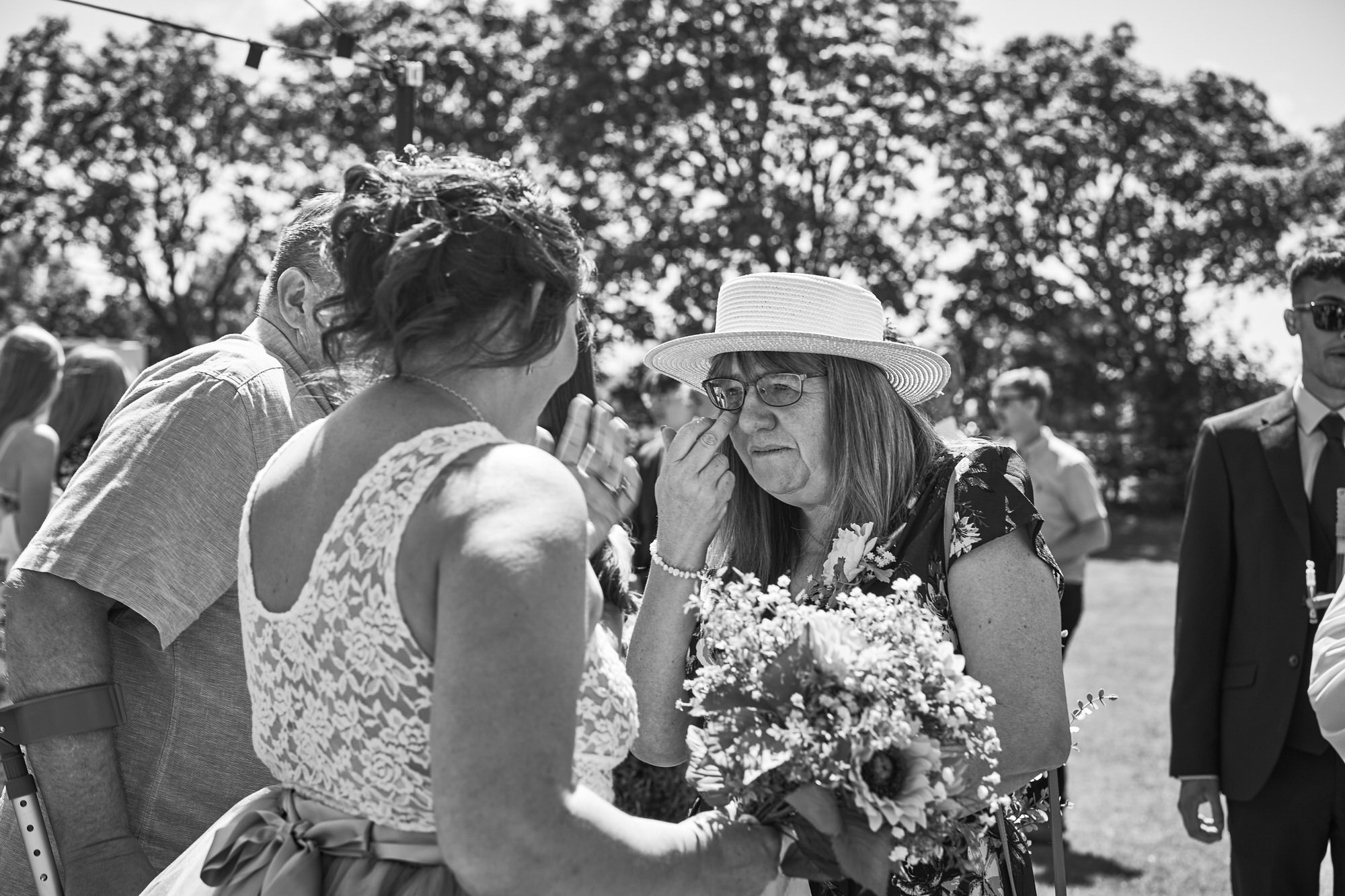 emotional guests speak to the wedding couple