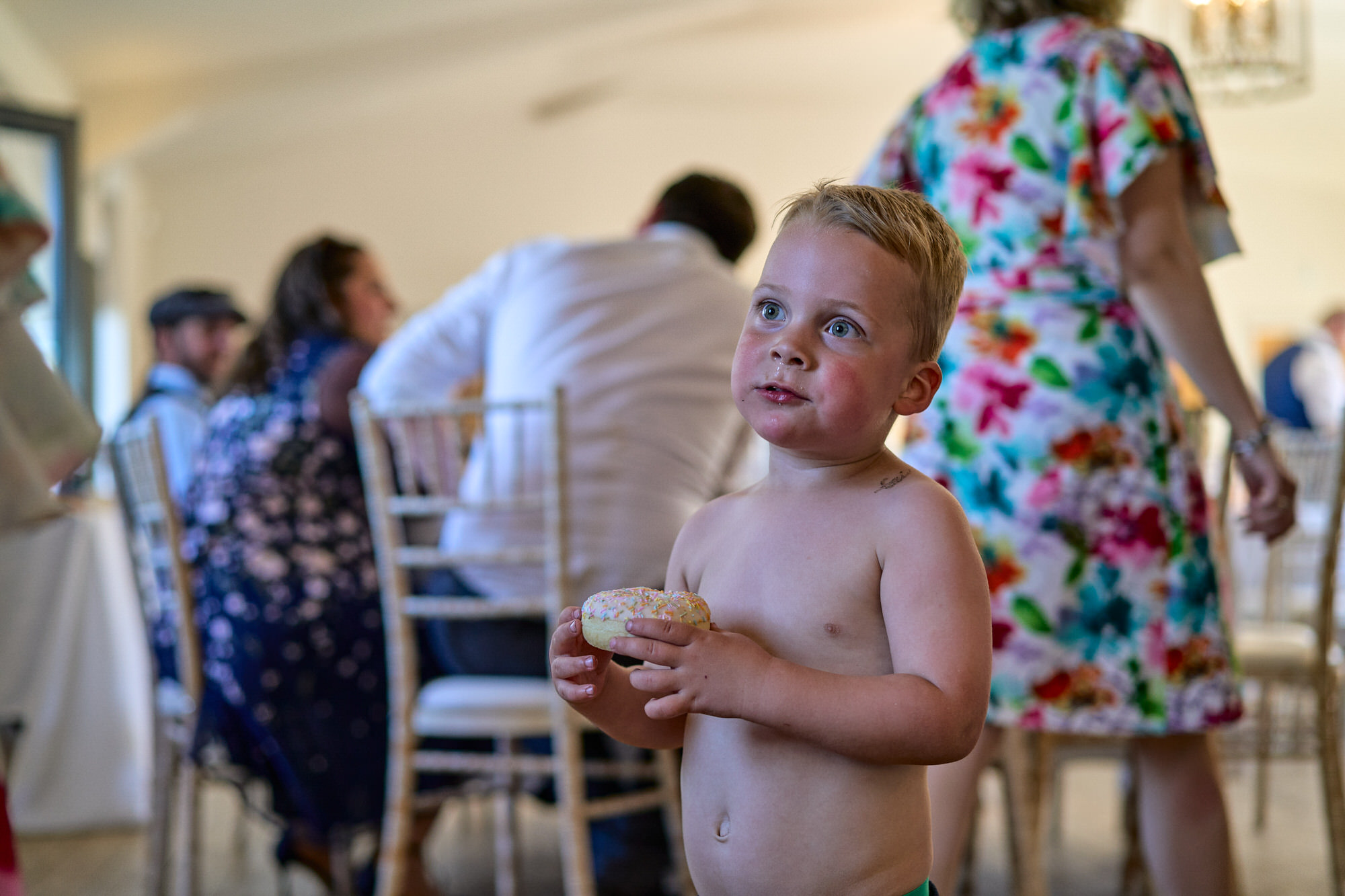 a young guests enjoys a doughnut