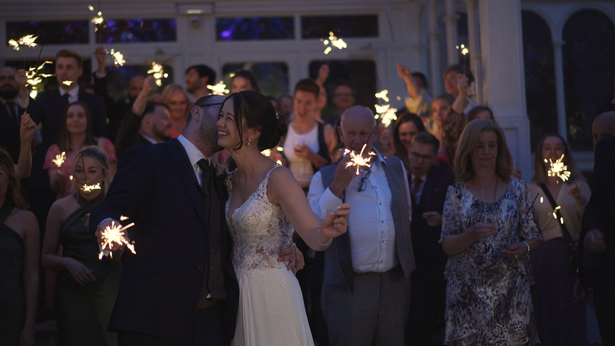 guests laugh during confetti shot outside Sefton Park Palm House Liverpool