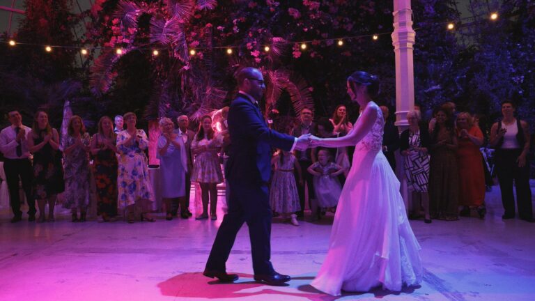 a wide video shot of a couples choreographed first dance at Sefton Park Palm House Liverpool
