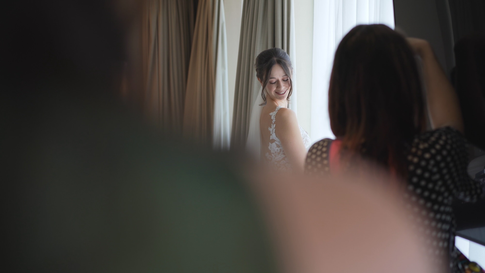 a natural video still capturing a bride posing for her wedding photographer at The Hilton Liverpool