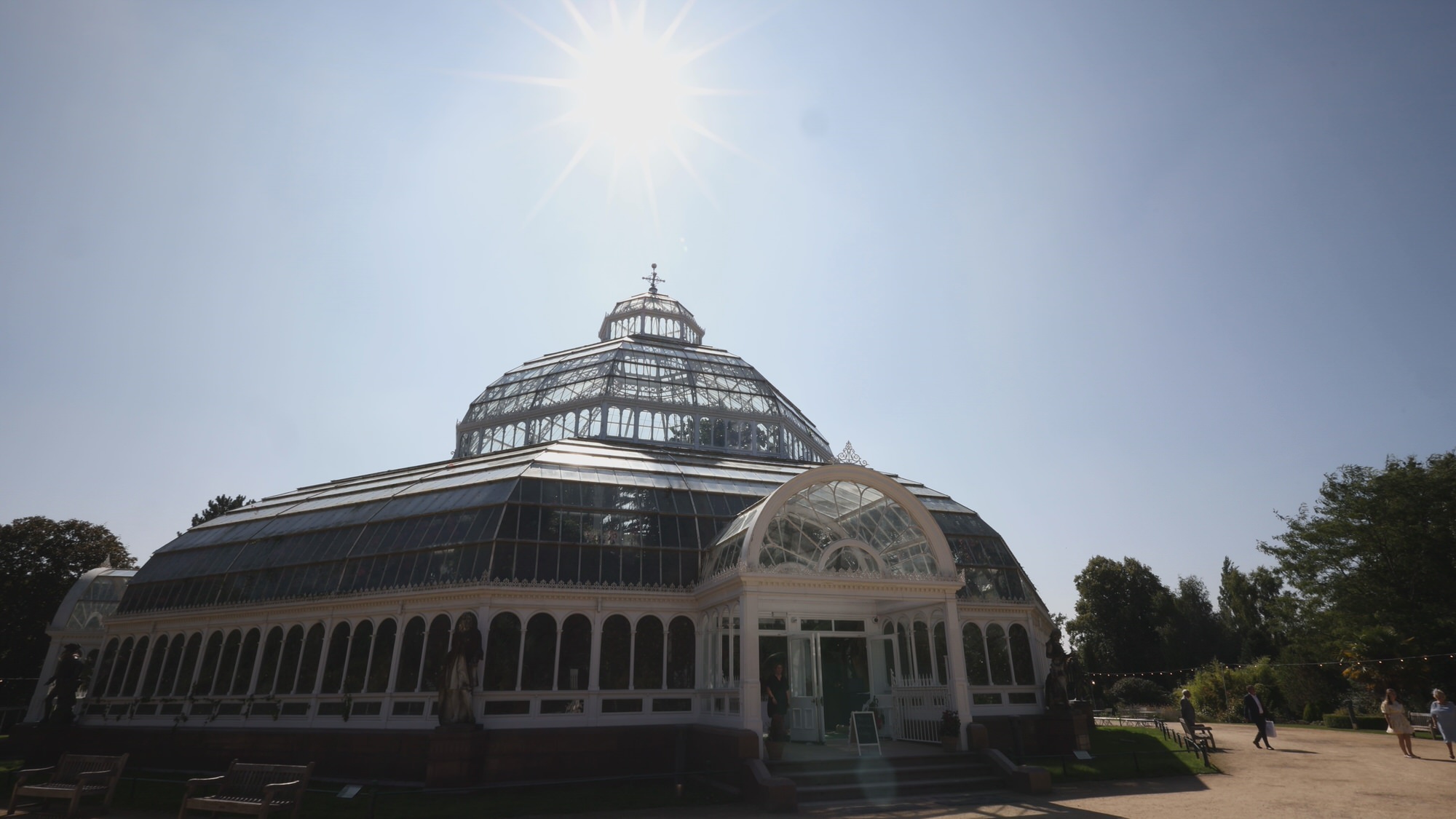 a video still of sefton park palm house on a sunny wedding day
