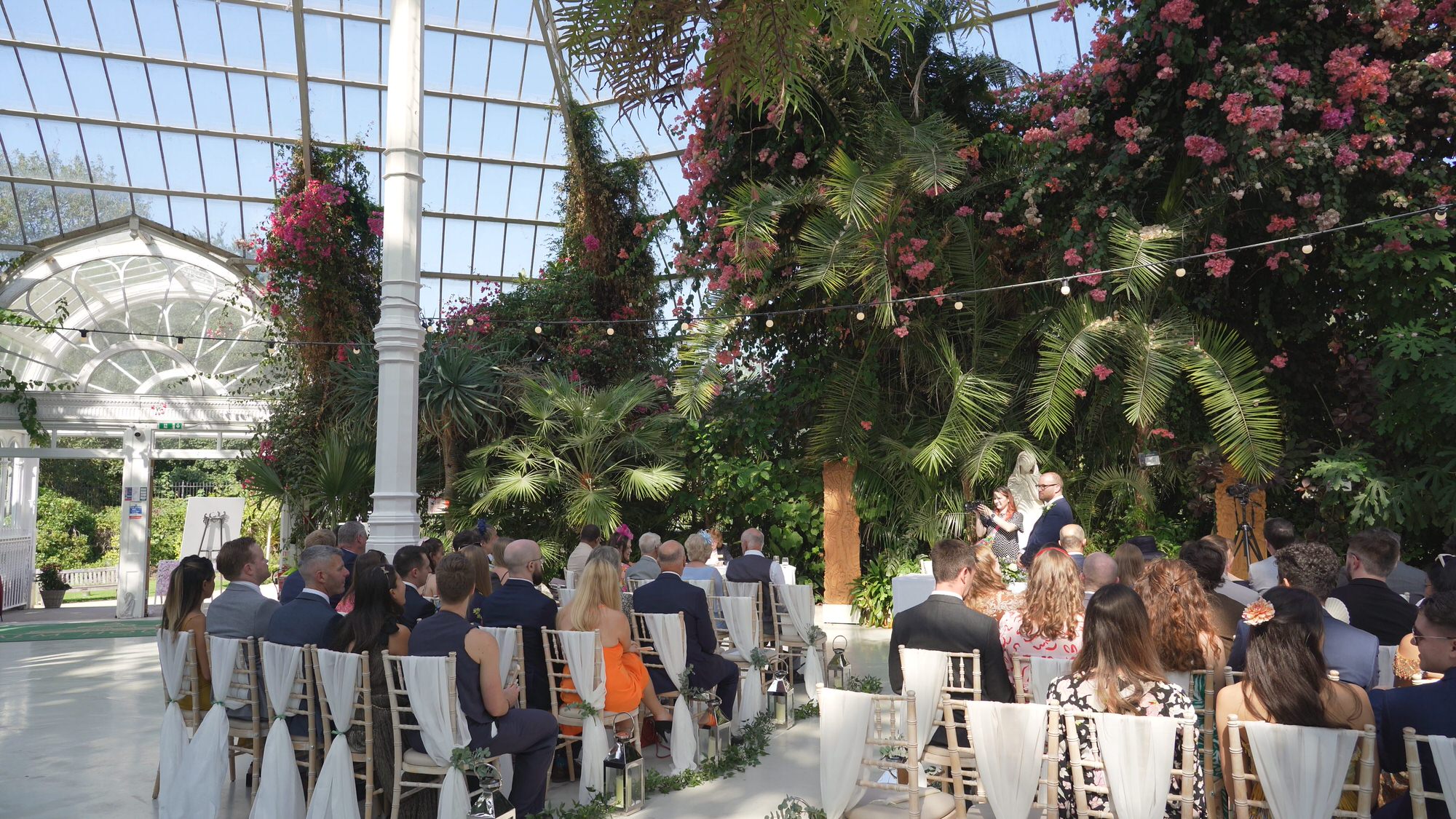 a wide video shot of inside Sefton Palm House wedding ceremony