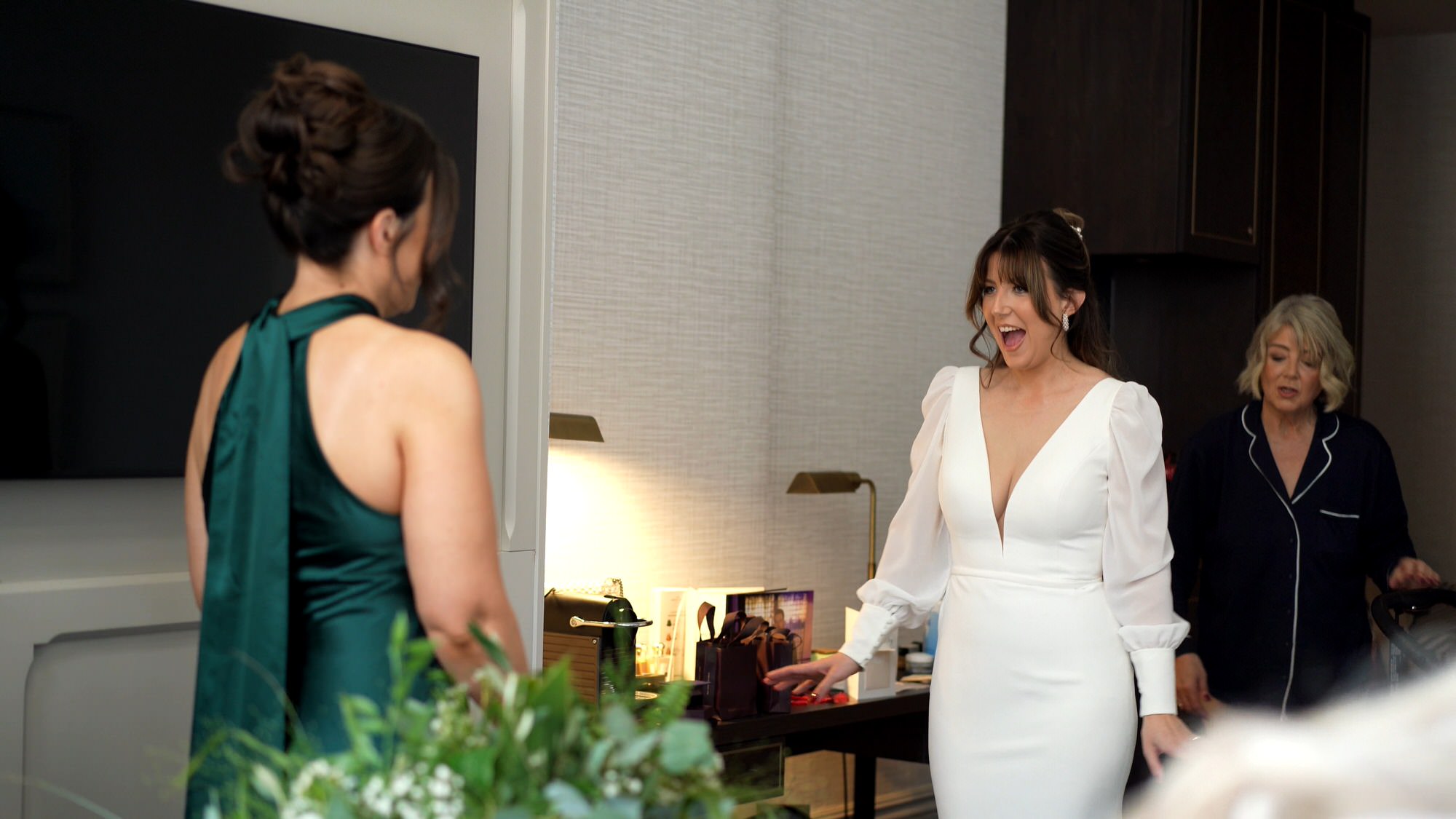 a bride shows off her Trish Peng wedding dress