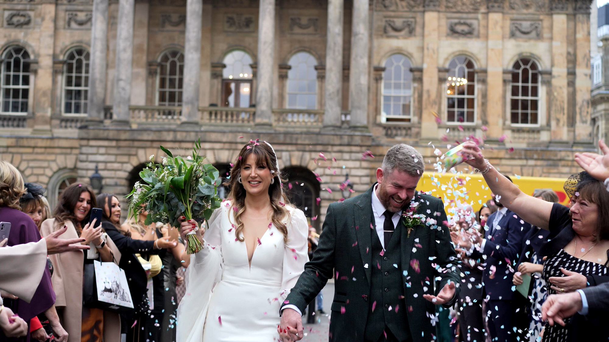 candid wedding videography moment outside Liverpool Town Hall and confetti