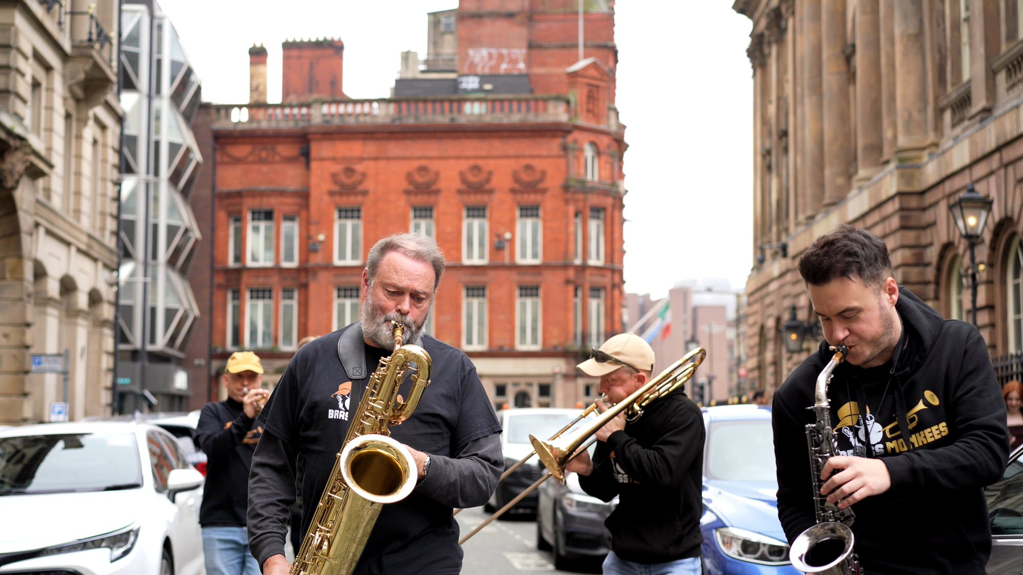 Brass Monkees wedding band walking past Liverpool Town Hall