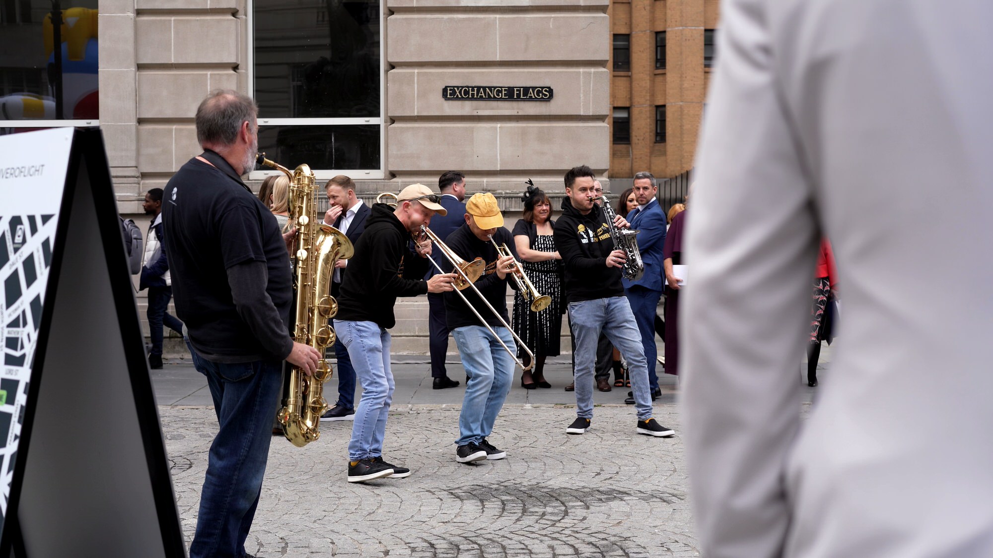 walking band brass monkees play in Exchange Flags for wedding