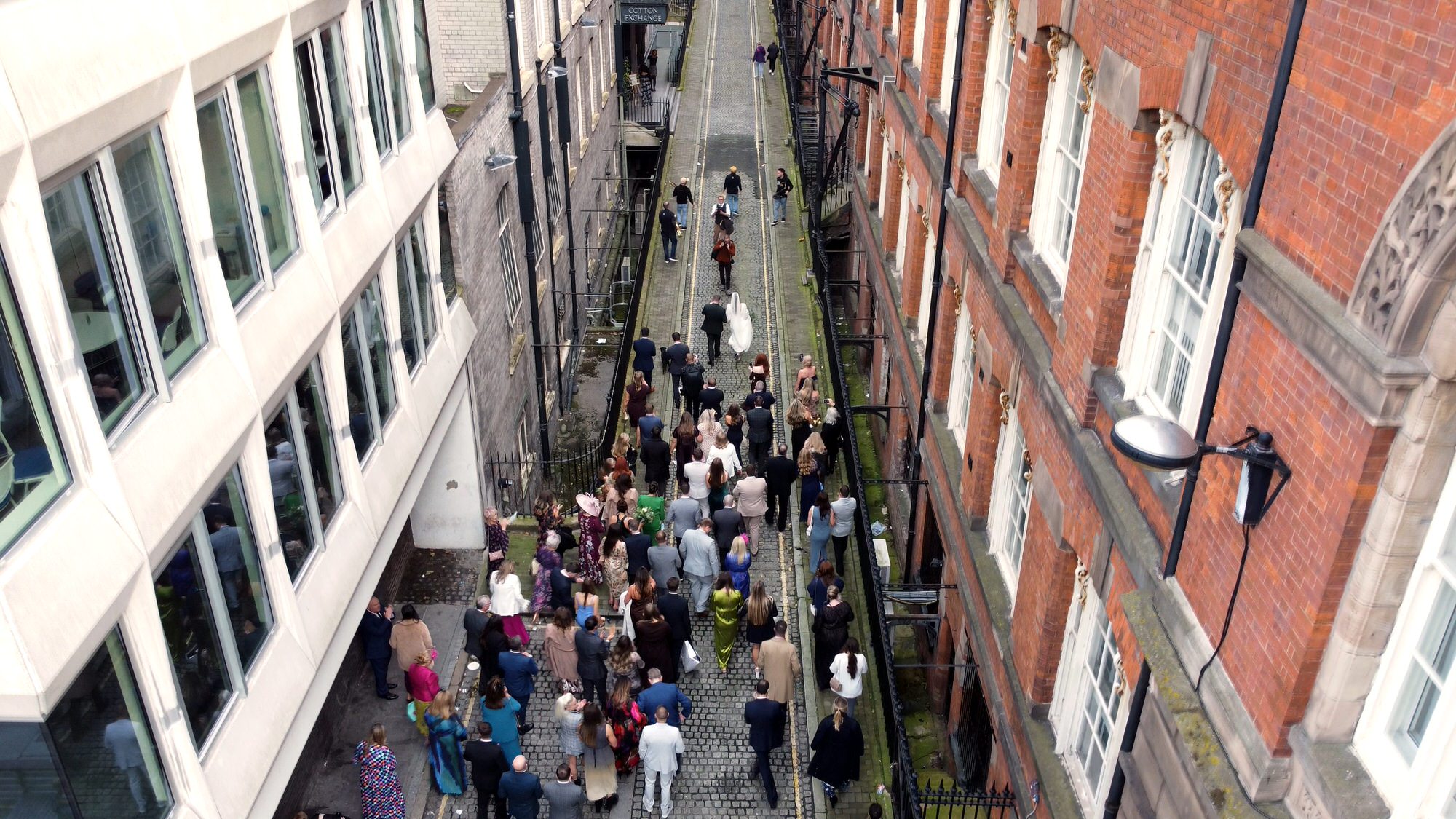 drone footage of wedding party dancing towards One Fine Day Liverpool