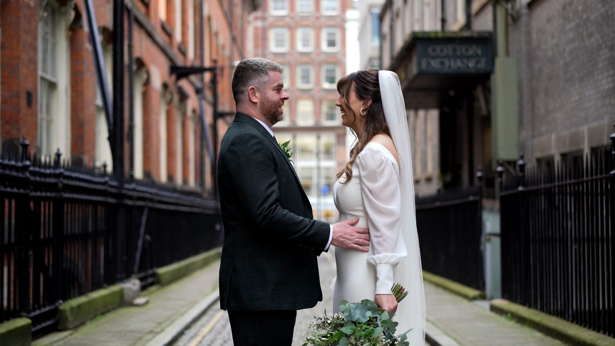 a more relaxed and natural moment of a couple laughing outside One Fine Day Liverpool