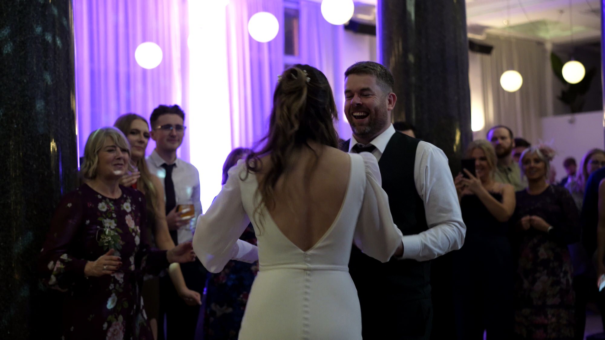 natural video moment of couple laughing during their first dance