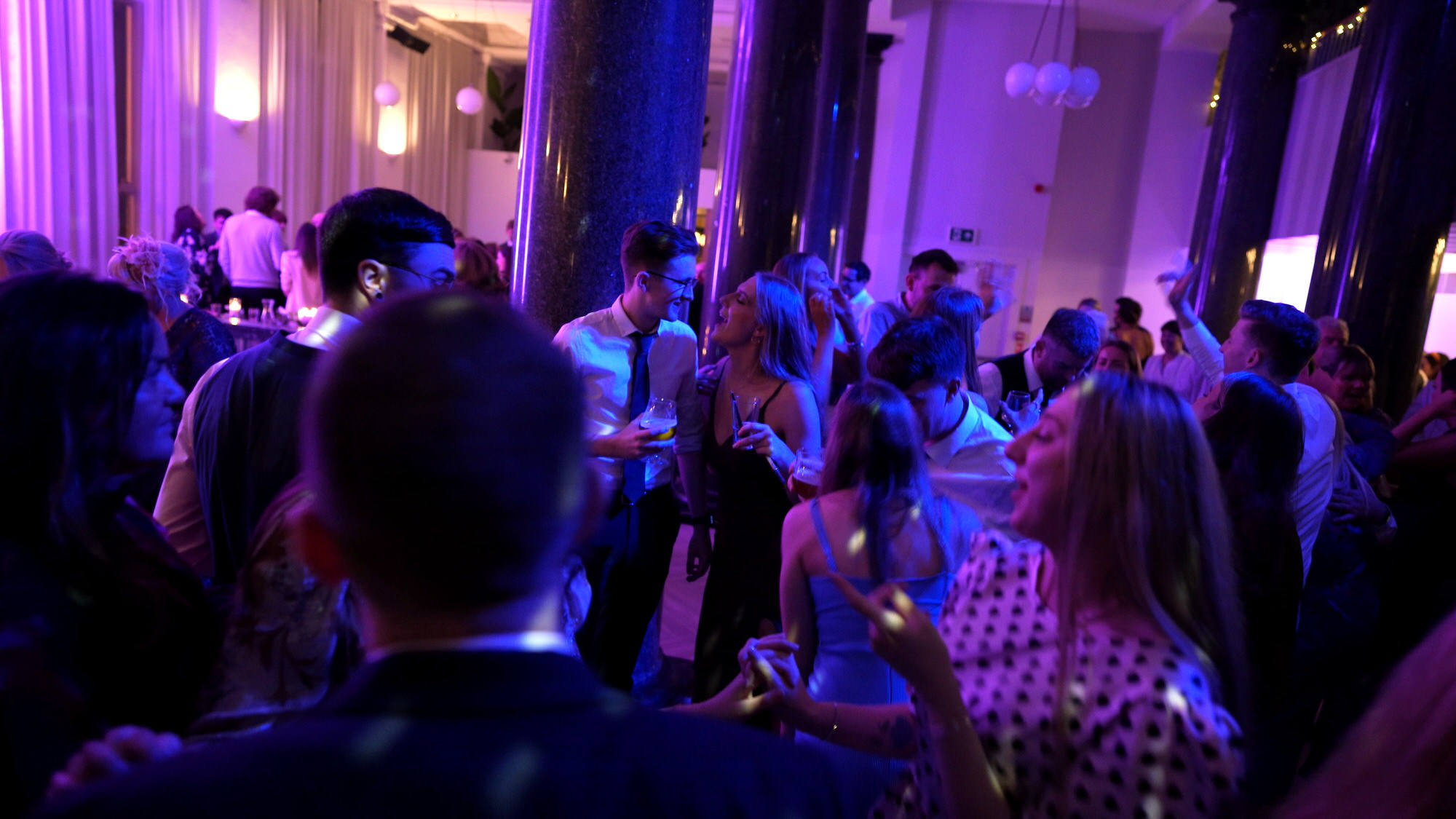 group shot of guests dancing at One Fine Day