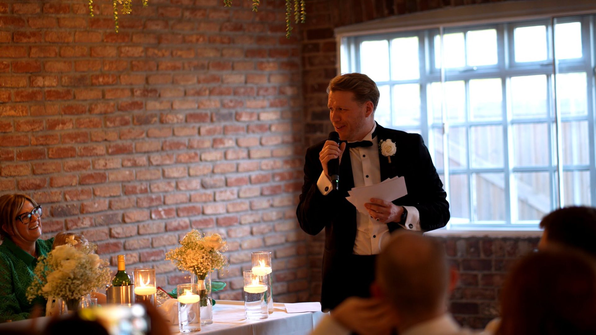a best man makes everyone laugh during speeches