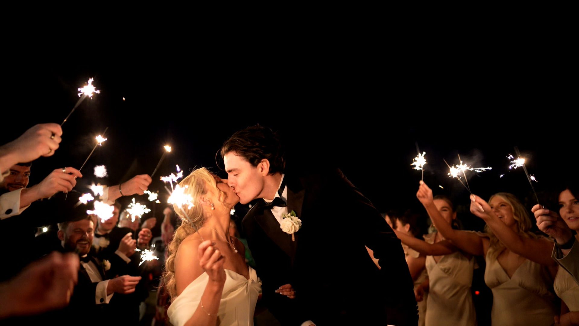 a video still of a couple kissing surrounded by sparklers at Larkspur