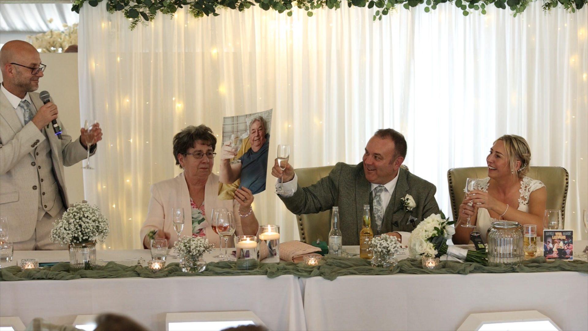 the family toast their dad who couldn't be there
