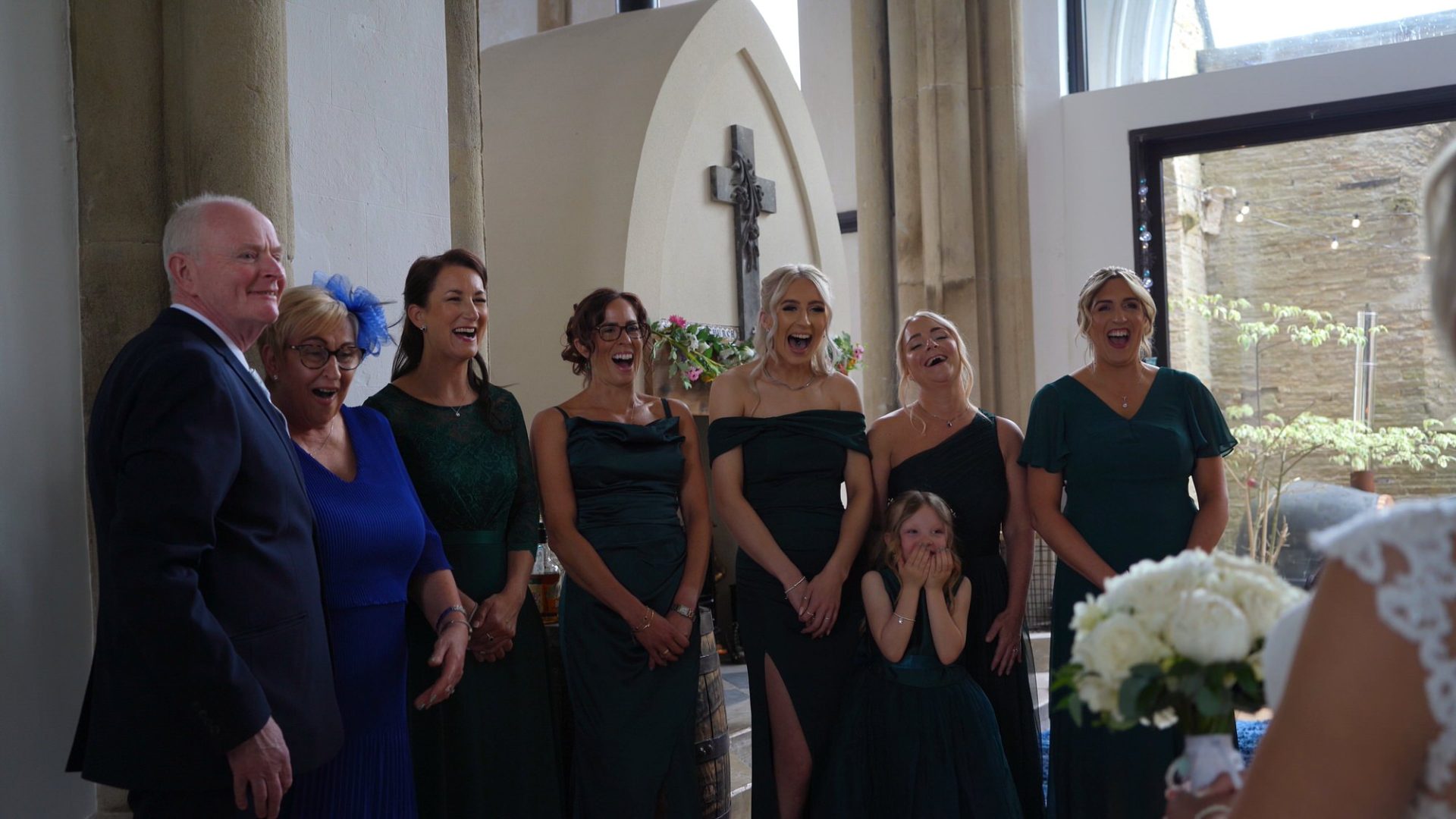 family and bridesmaids react to the brides first look in Halifax