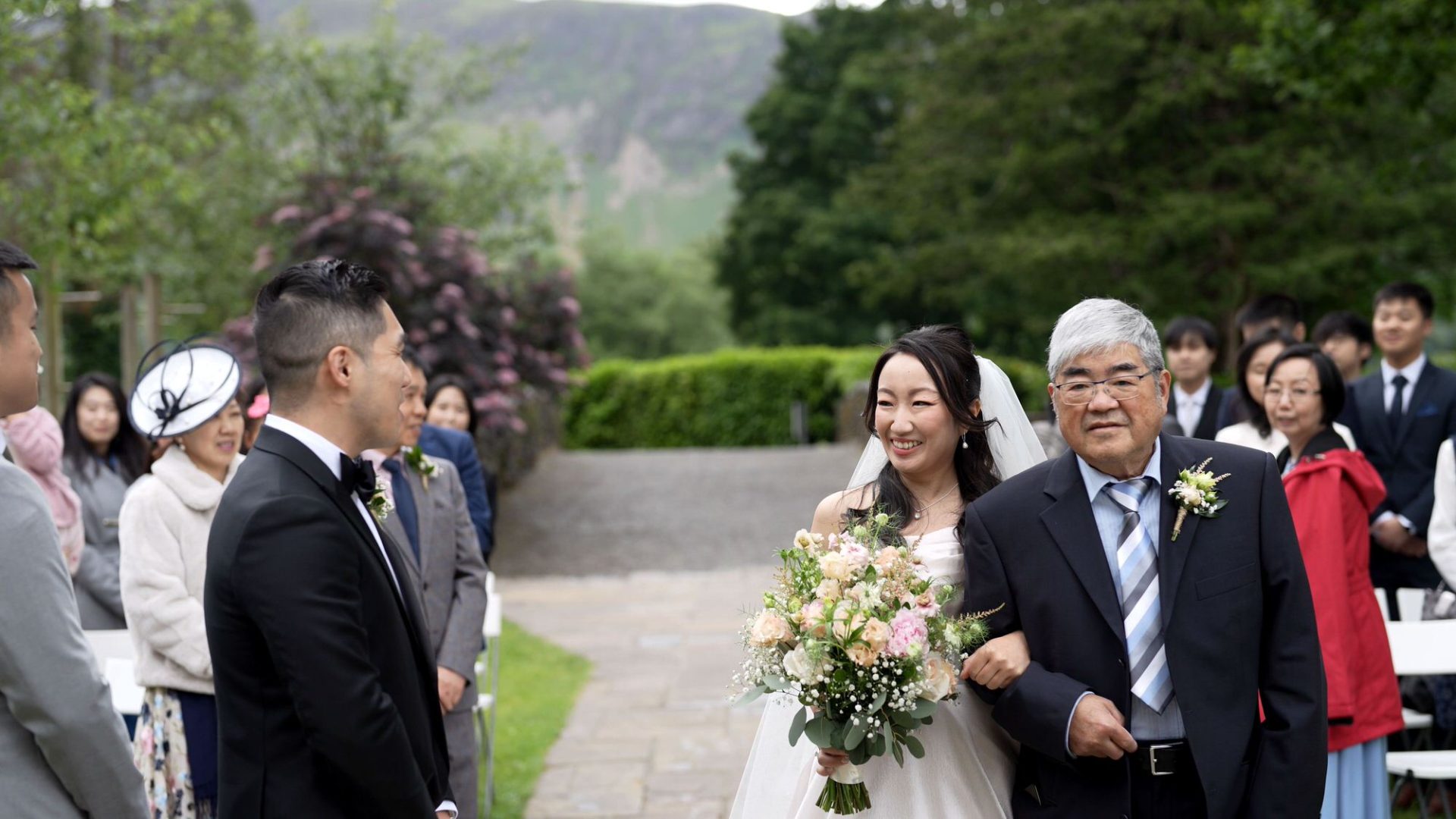 a natural moment of the couple meeting at the top of the aisle