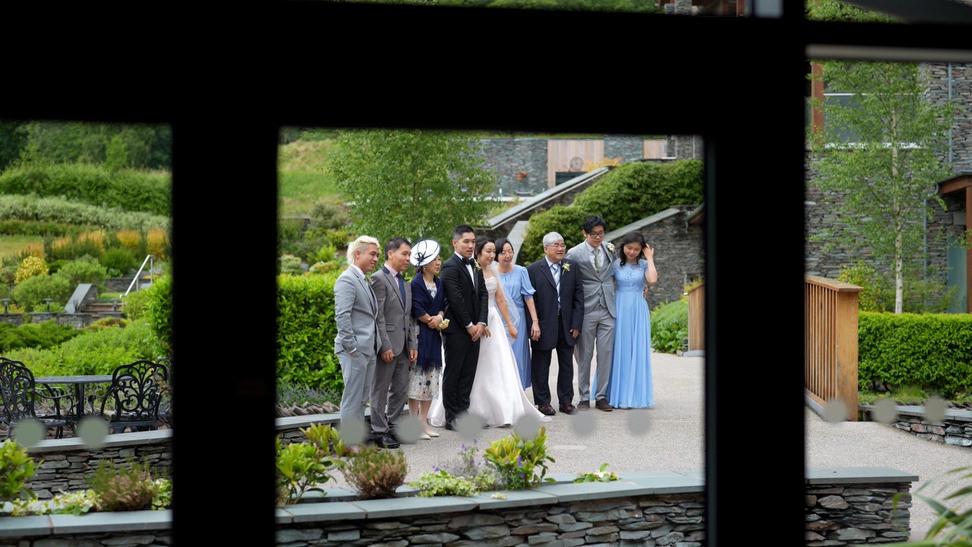 a video shot through the window of the conservatory filming group photos