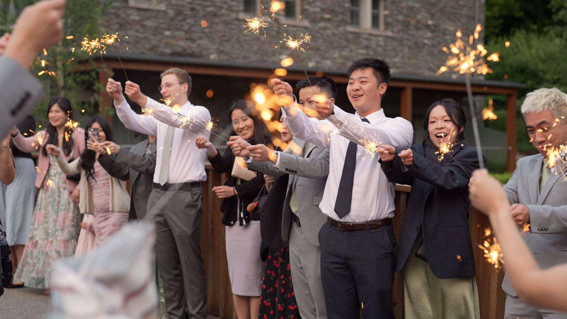 guests wave their sparklers outside Lodore Falls